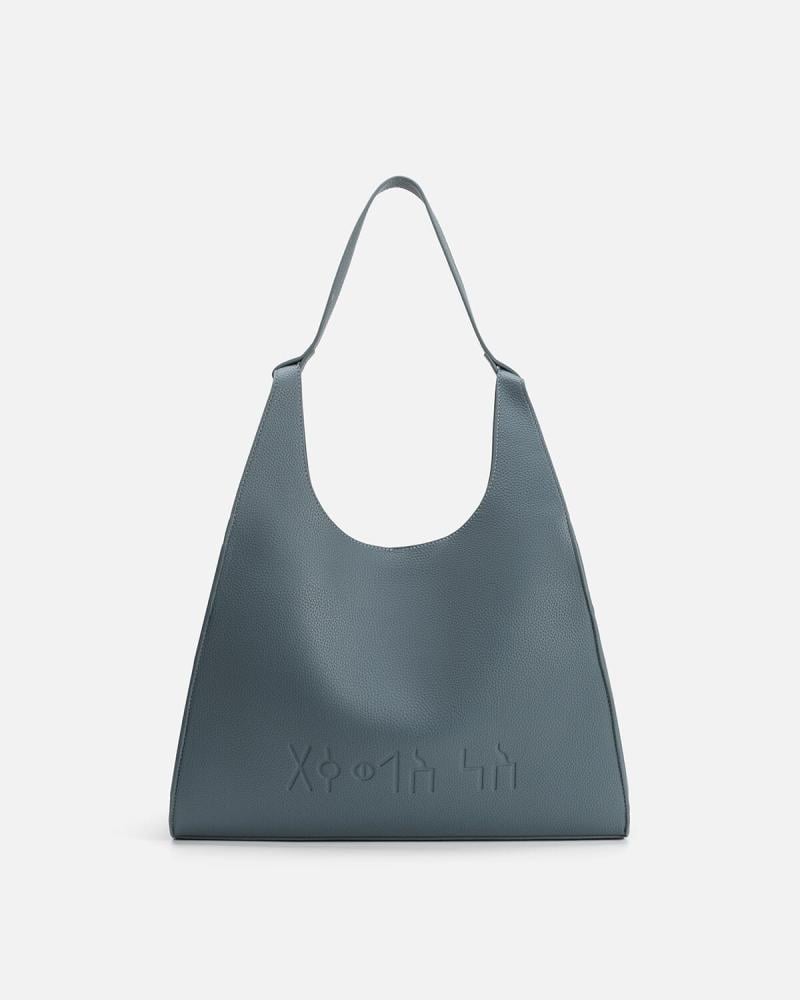 شنطة نسائية من الجلد بلون أزرق